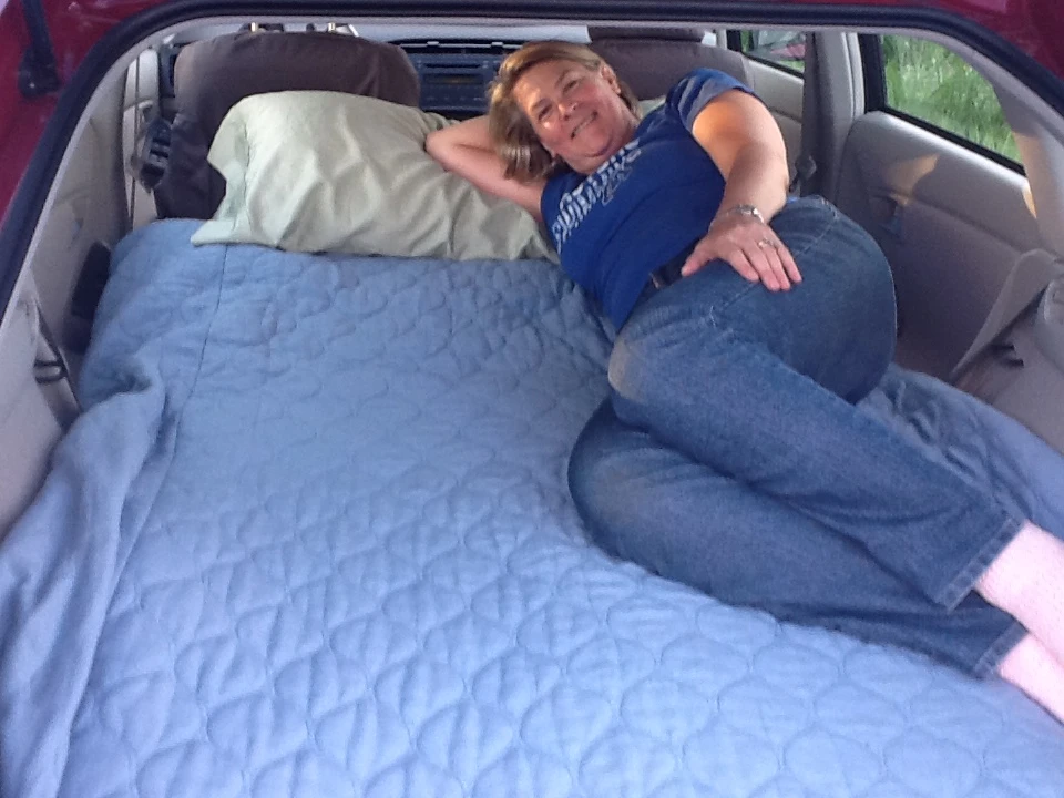 It looks snug, but it has to be more comfortable than leaning back in the front seats