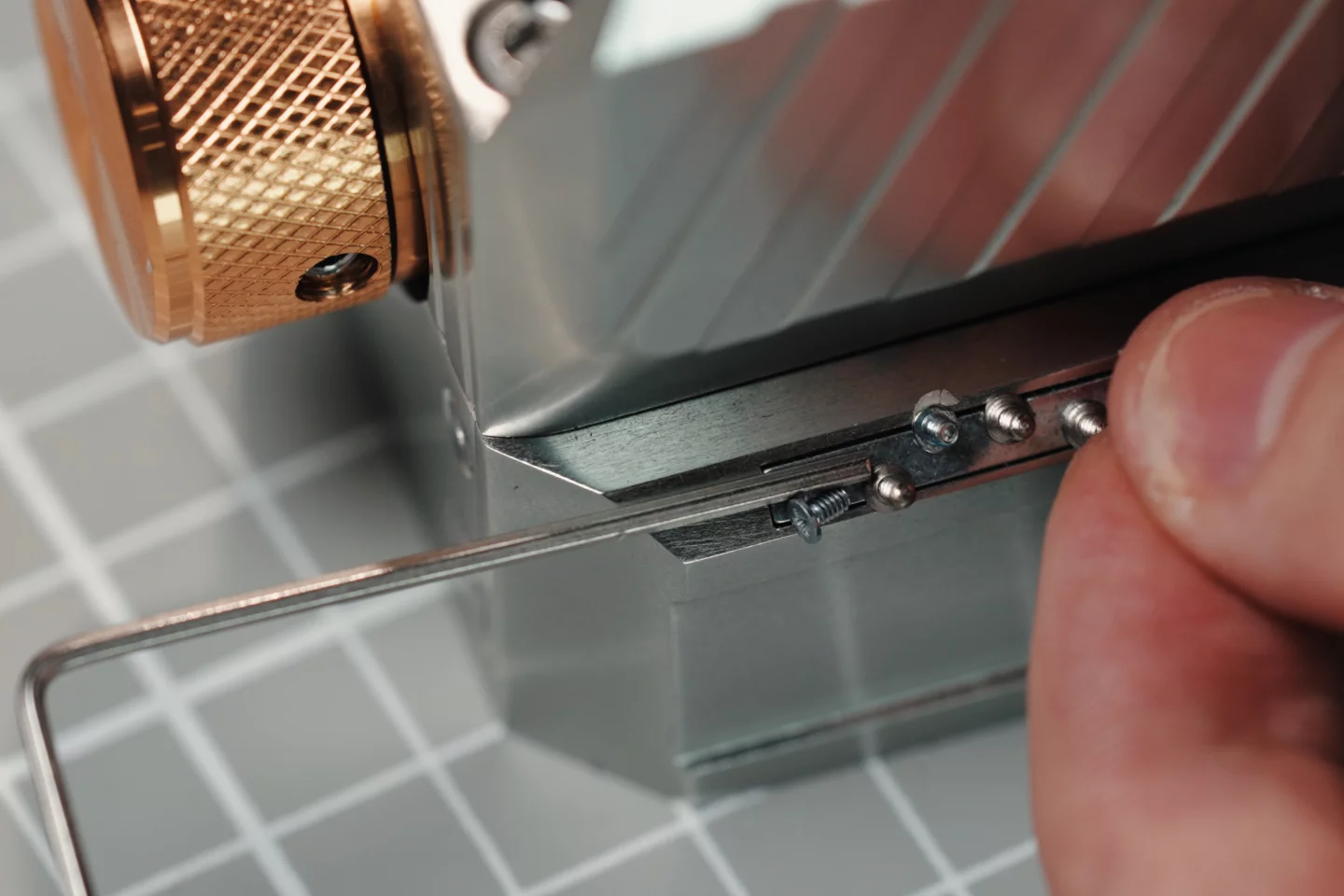 Magnetic strips are used to retain items such as tiny screws