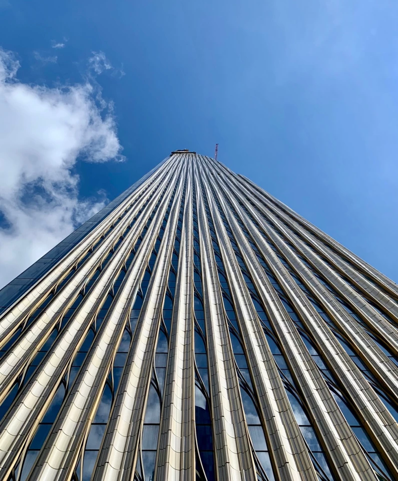111 West 57th Street's facade is made up of terracotta panels with 22 different sets of contours contrasting with bronze detailing and a glass curtain wall