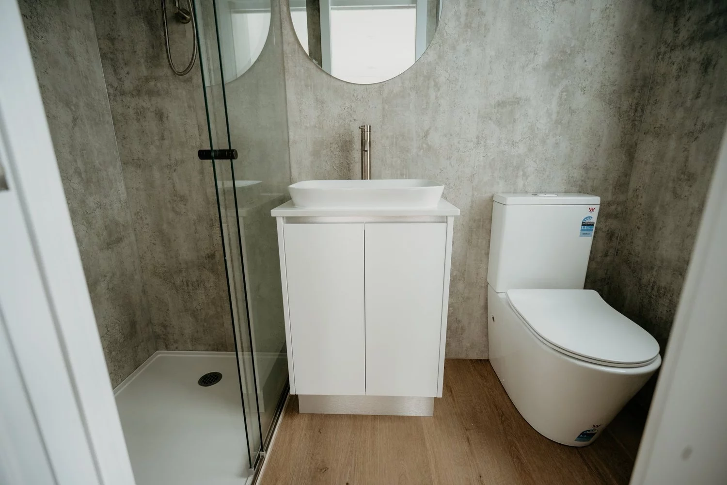 The Wanda's bathroom includes a shower, vanity sink, and a flushing toilet, though this can be upgraded to a composting or incinerating toilet