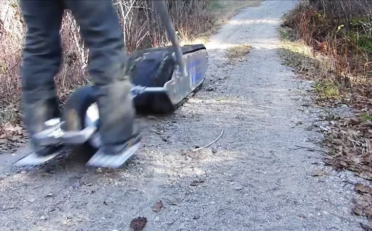 With an attached wheel, the MTT-136 becomes an electric personal mobility device for the woods