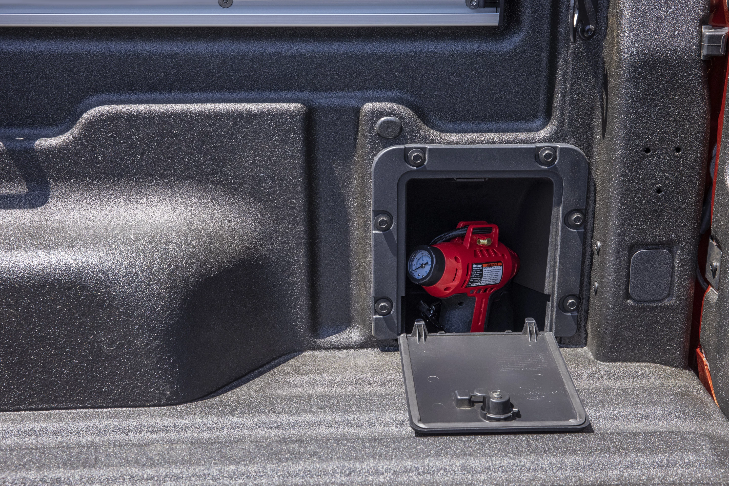 Storage for small air pumps and other accessories is also found in the in-bed liner