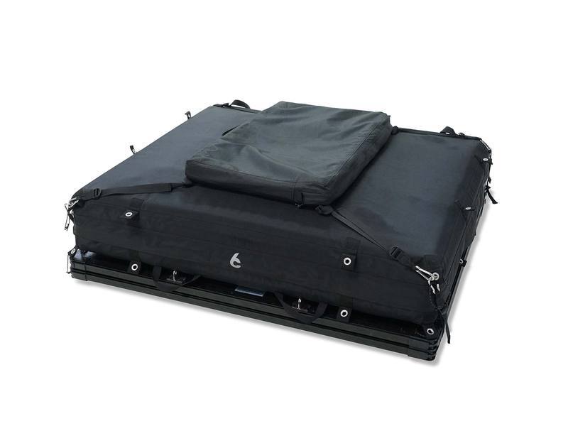 Rev tent sandwiched between the ladder and platform for travel; unlike other RTTs, the Rev doesn't simply fold out at camp and requires detaching and separate tent-to-platform setup
