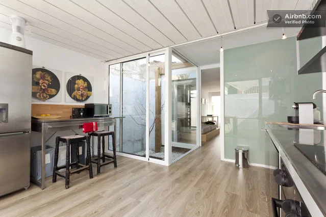 The home has been stylishly decorated throughout, while the ceilings are the only evidence of its shipping container structure
