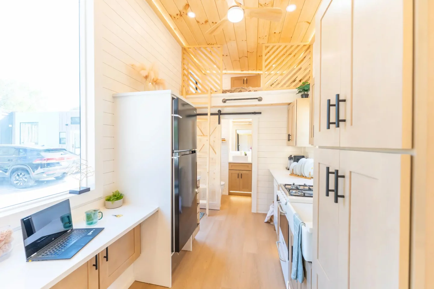 The Premium Vista's kitchen includes a breakfast bar-style dining/desk area