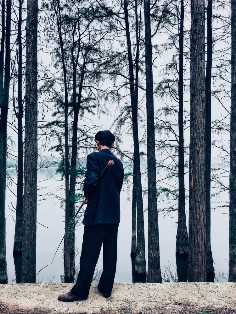 1st Place, Lifestyle. Fishing, Wuhan, Hubei, China, iPhone 6S. “A man fishing by the lake, it feels like it came out of the movie called The Grand Budapest Hotel."
