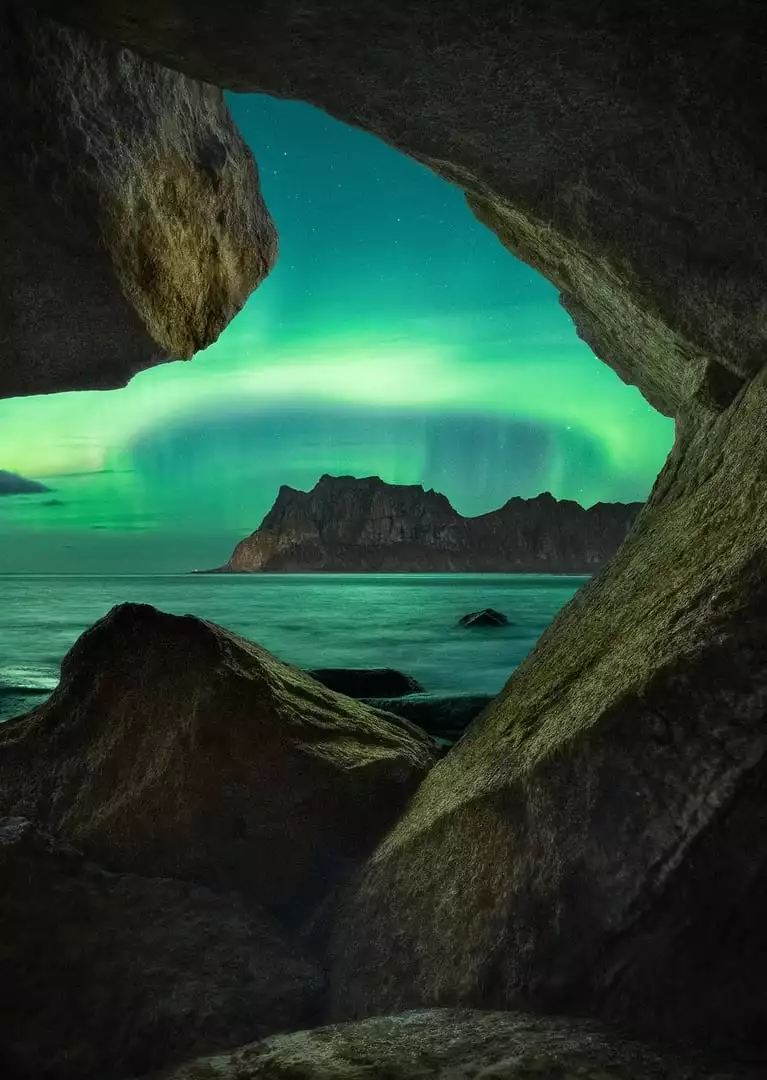 The Aurora Cave by Giulio Cobianchi, taken on the Lofoten Islands, Norway. The photographer says that this shot required techniques like focus stacking and multi-exposure to capture all the layers and produce a three-dimensional effect.