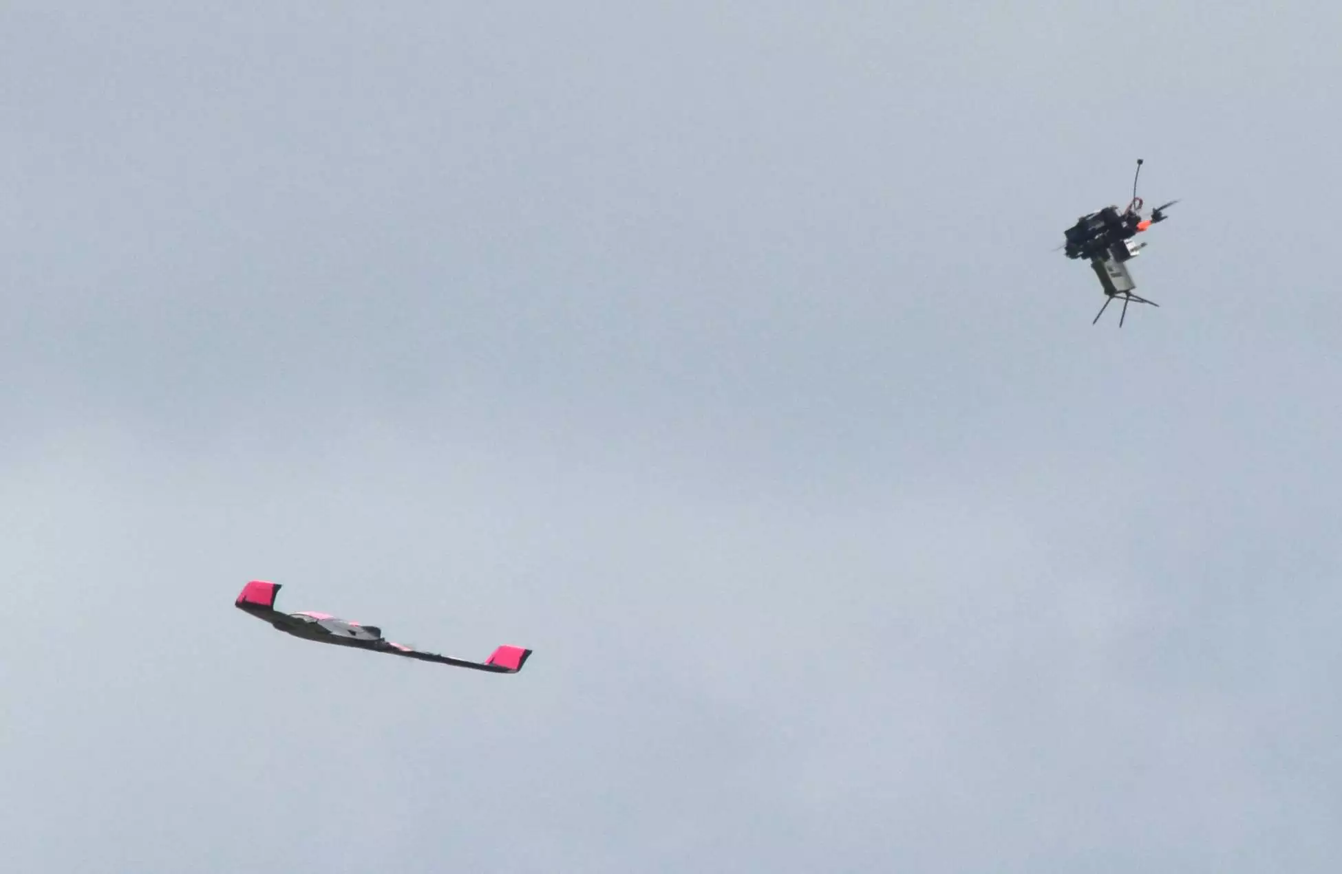 Quadcopter with Claymore (right) engages SkyRaider drone