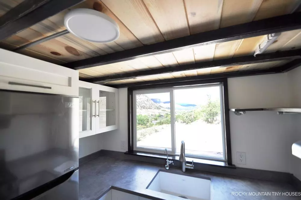 The Ad Astra's kitchen window lifts upwards to serve food outside on the deck