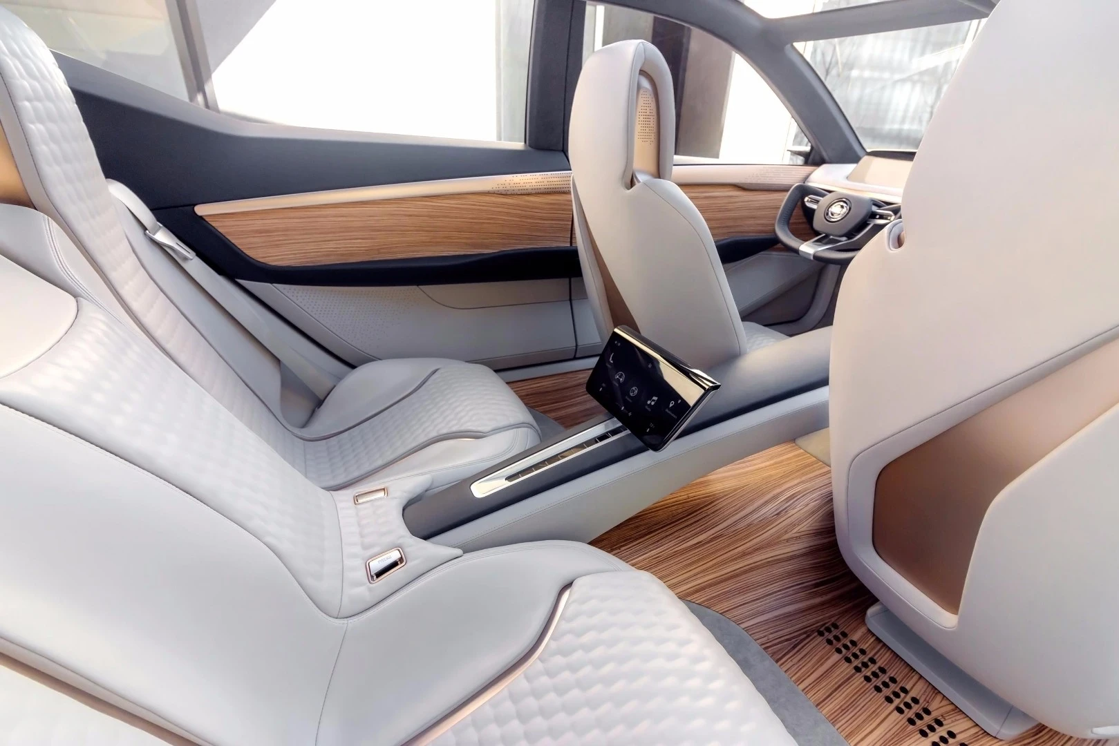 The center tunnel runs between the captain’s-style chairs and hosts a pop-up tablet-like interface
