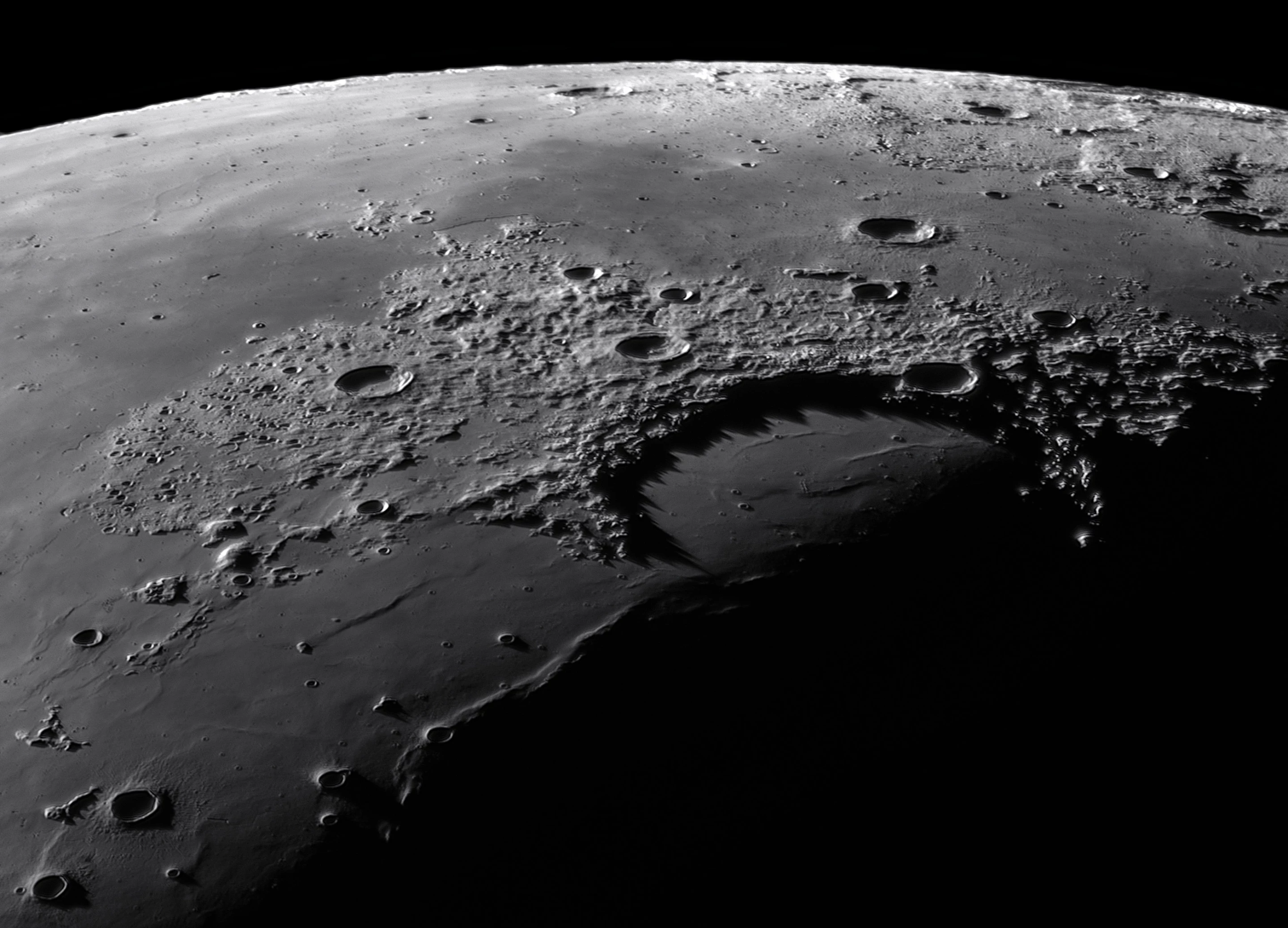 Our Moon Winner: Shadow peaks of Sinus Iridum © Gábor Balázs (Hungary). This image captures a region of the lunar surface called Sinus Iridum, or the Bay of Rainbows.