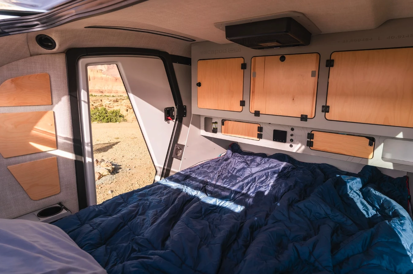 Escapod has trimmed out the interior in soft-touch materials and wood to ensure it's just as warm as the original Topo (which featured Baltic birch in its construction)