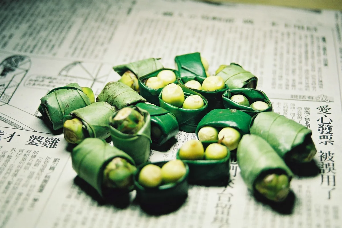 Betel nuts wrapped in betel leaves, a common preparation for chewing