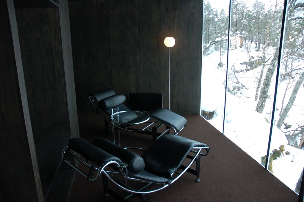 The interior is kept quite simple, with a few pieces of designer furniture