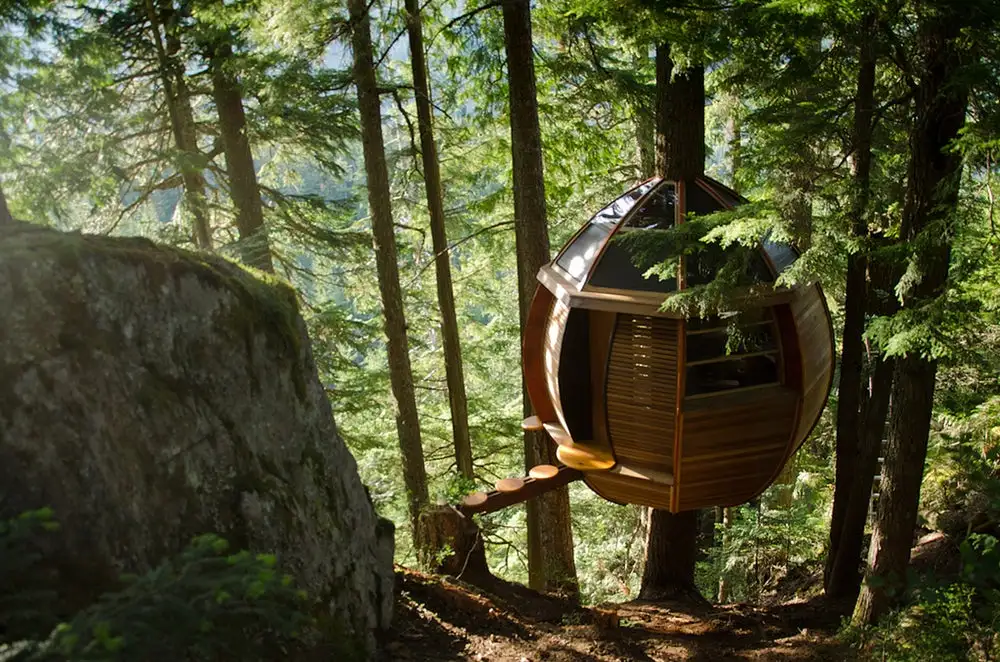Unlike many buildings described as such, the HemLoft in British Columbia, Canada is a treehouse in the truest sense: the entire weight of the egg-shaped structure is supported by the tree around which it is built