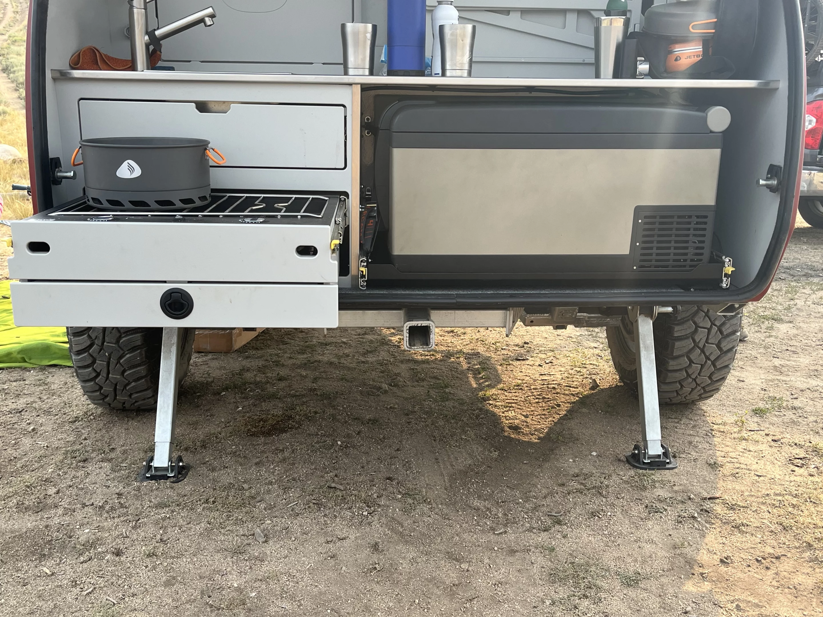 Escapod's design leaves a large space for the Yeti cooler or Arb fridge