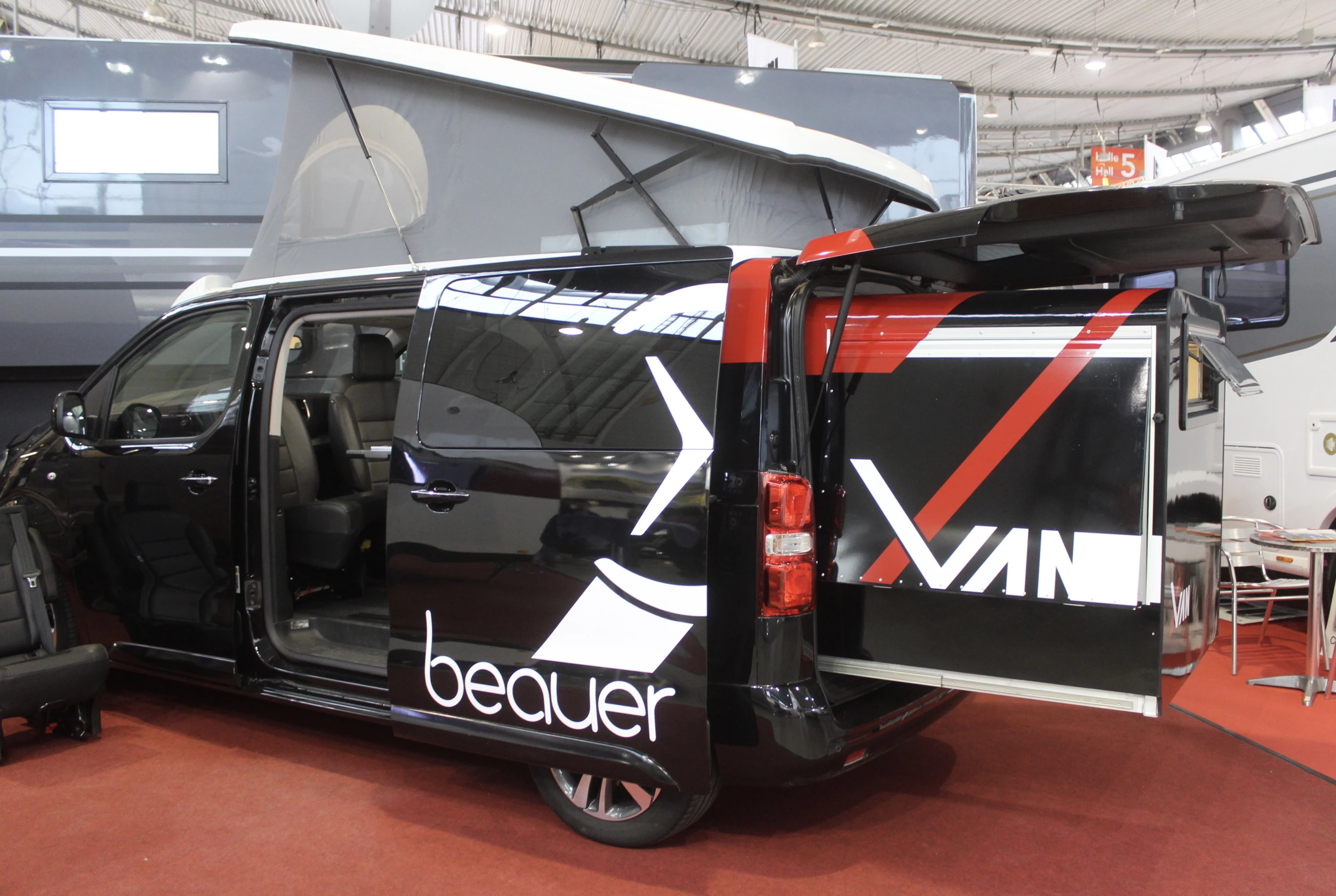 The Beauer X-Van adds a meter of length to the van, creating a bed without the need to fold any seats