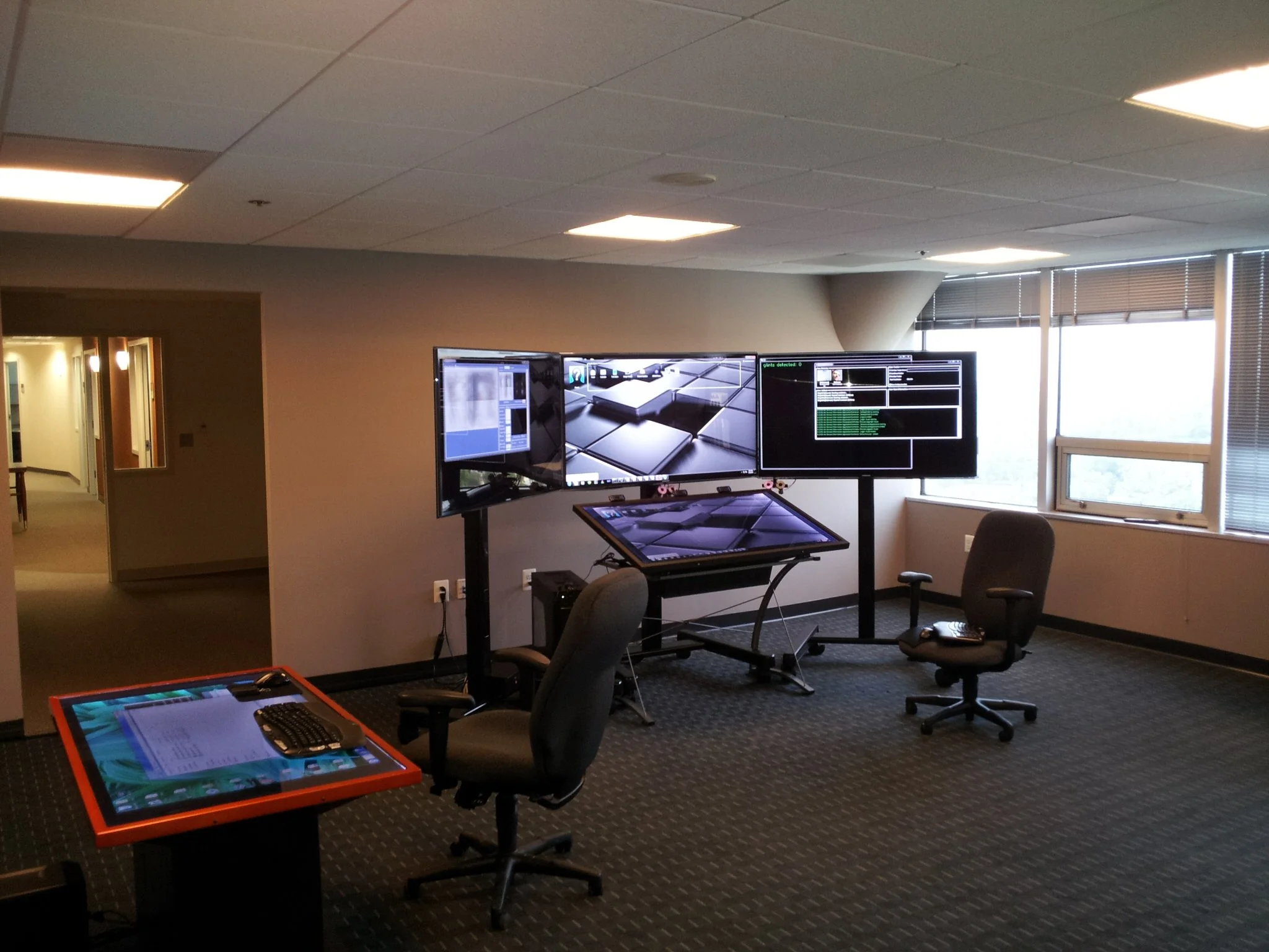The screen on the left displays user data collected by the system, while the one on the right shows sensor activity
