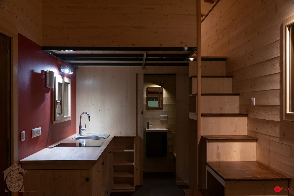A storage-integrated staircase leads up to the Axelle's main bedroom