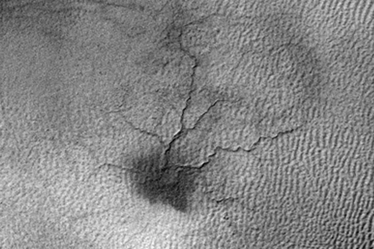 A spider-like surface feature on Mars that scientists believe is caused by thawing carbon dioxide ice