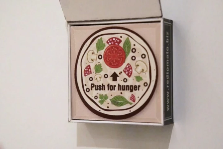 A Dubai-based pizza shop is offering refrigerator magnets to customers that automatically orders their favorite pizza over the Internet when the button on it is pressed