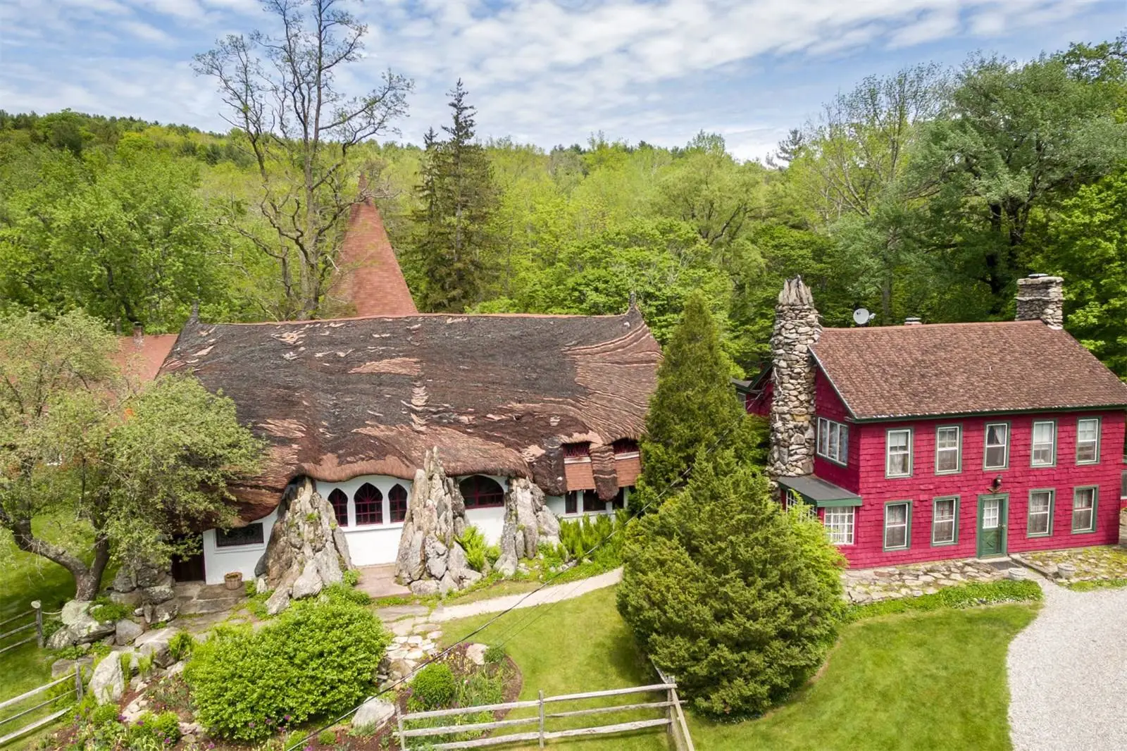 With stain glass windows, a multi-color roof and forest-like gardens, the so-called Tyringham Gingerbread House wouldn’t look out of place in a fairytale
