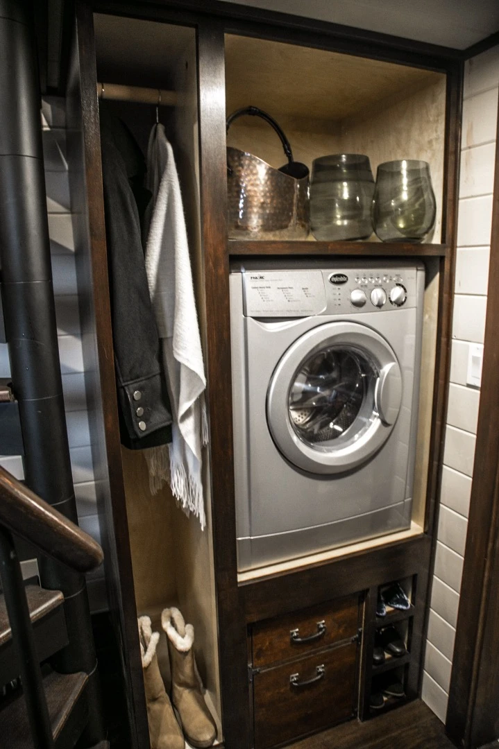 The Tudor-style tiny house includes a washer/dryer