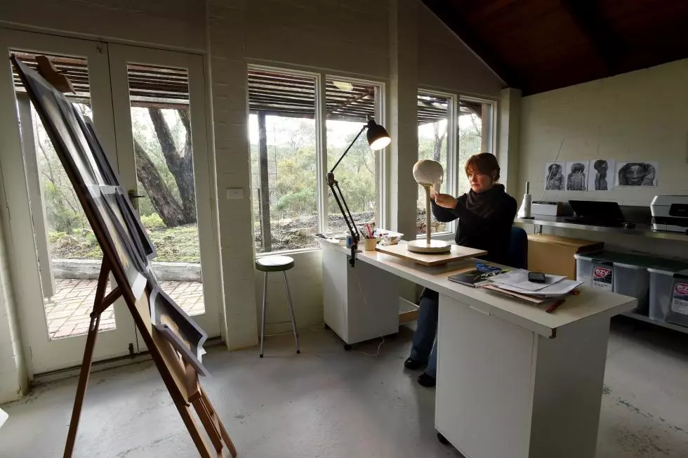 Sculptor Jennifer Mann working on Meritamun in her studio