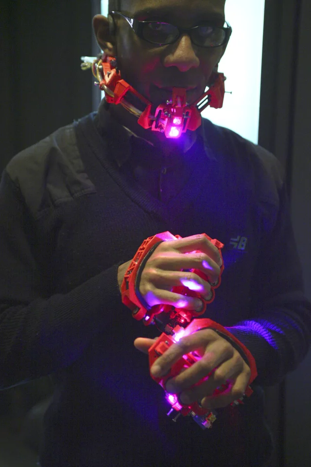 Yes, he does look like he's been assimilated by the Borg but that kind of fits the music, doesn't it?