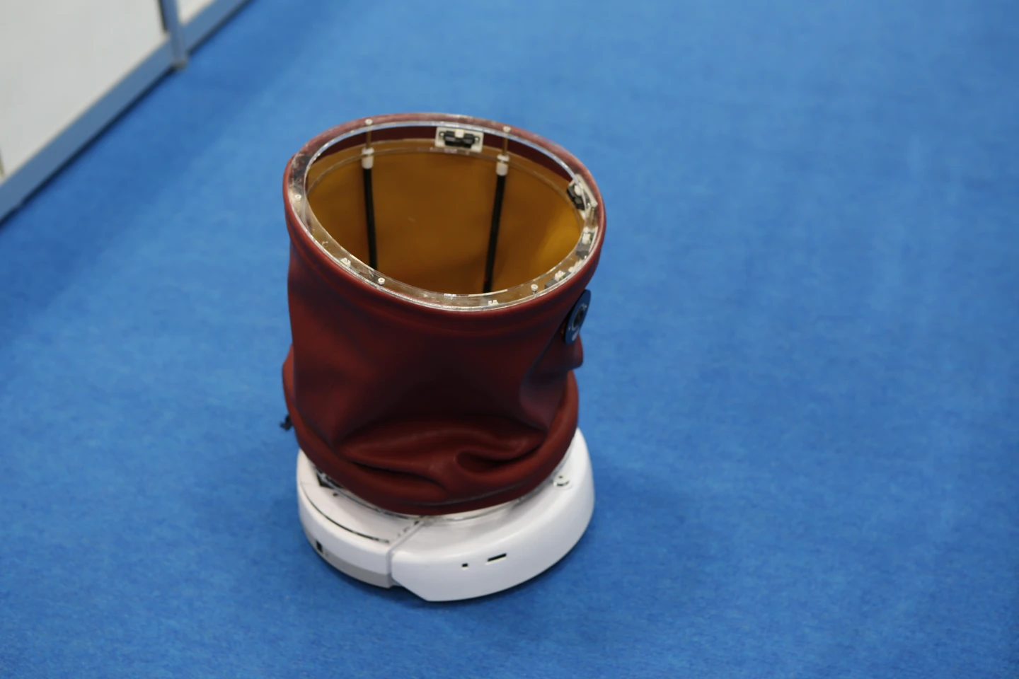 In order to help its human assistants "sink a basket," so to speak, the robot is able to tip its flexible bin forward or backward, or twist it to either side