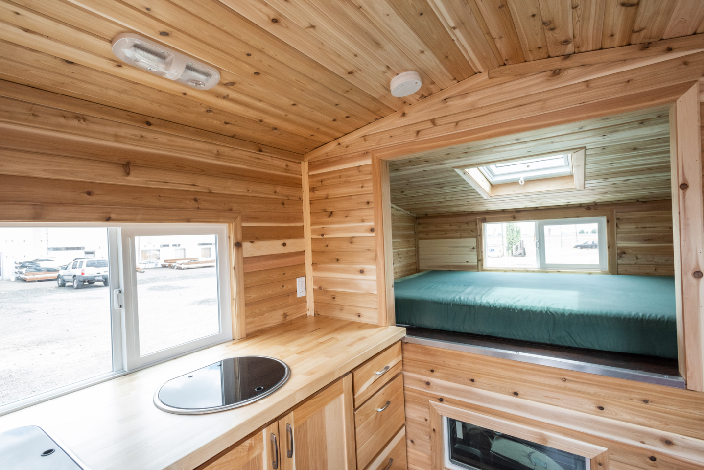 The kitchenette includes a propane-powered range oven