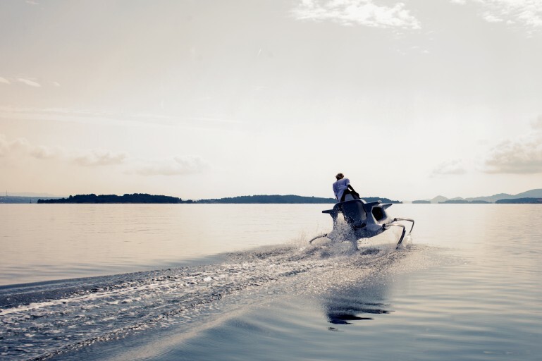 The Quadrofoil soars over top the water's surface
