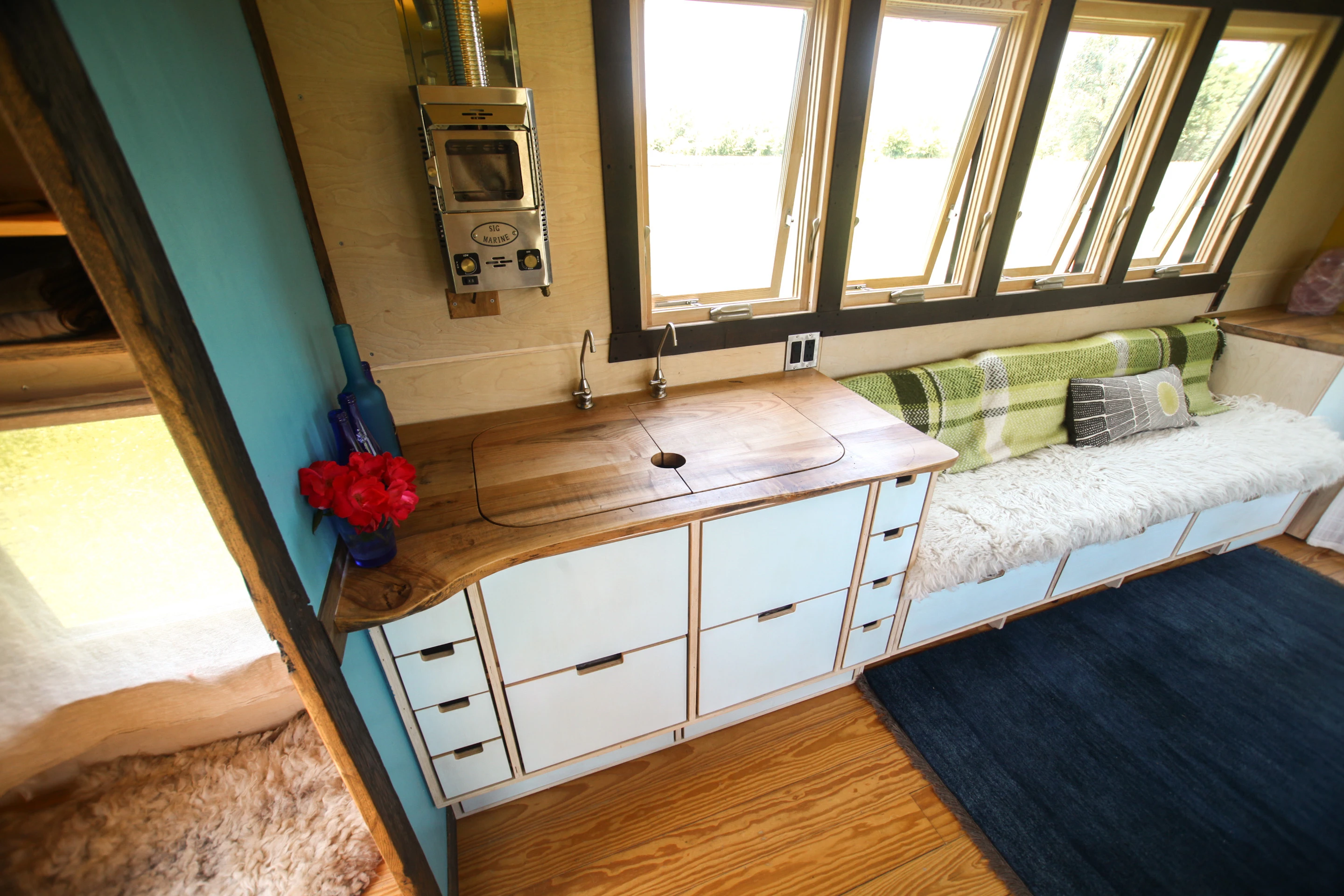 Pocket Shelter features a custom kitchenette with 2-burner gas cooktop