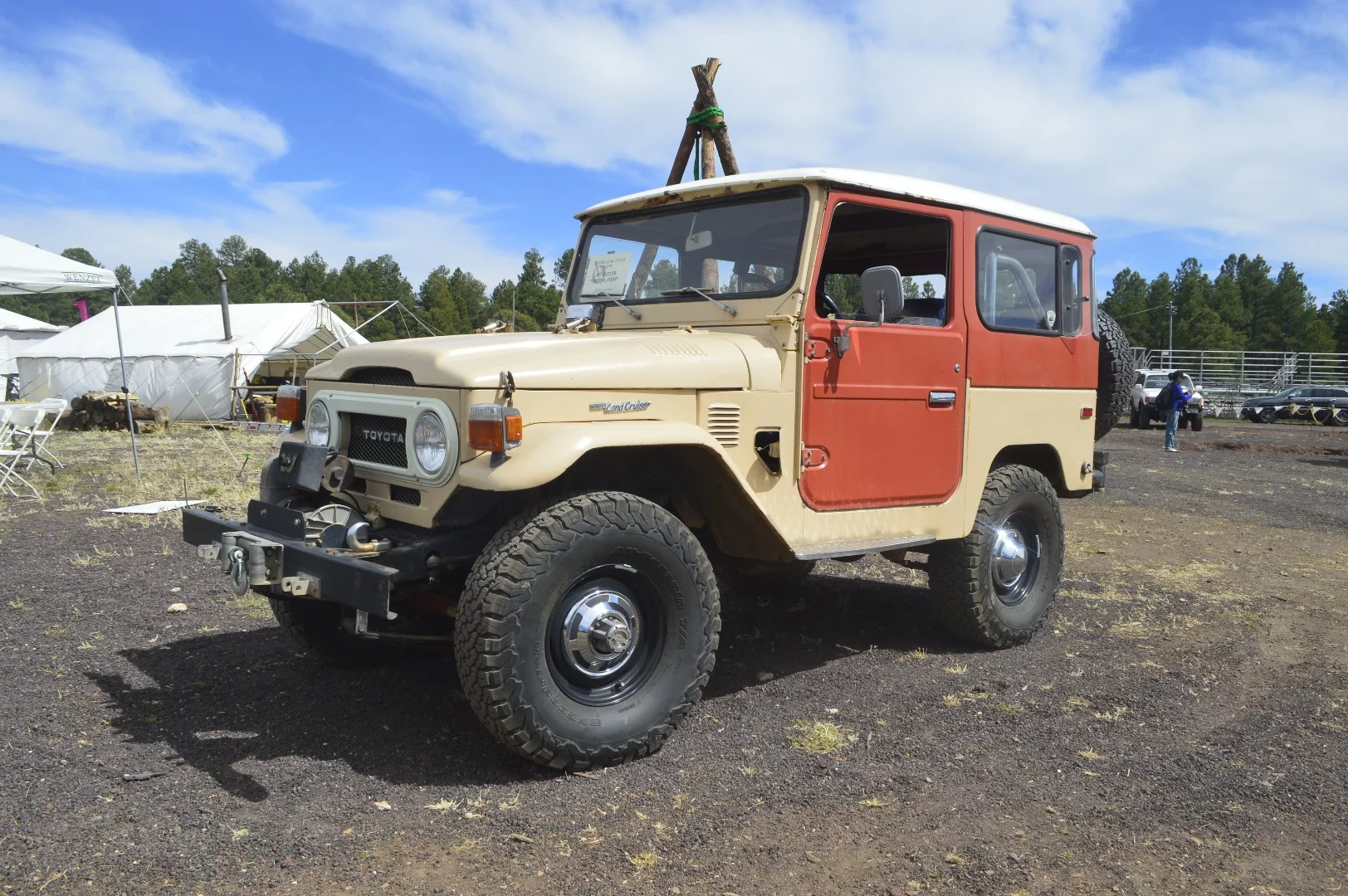 A colorful classic Land Cruiser in the skills and testing corner of the show