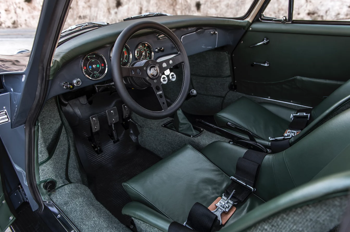 The graphite blue metallic exterior transitions to a green interior