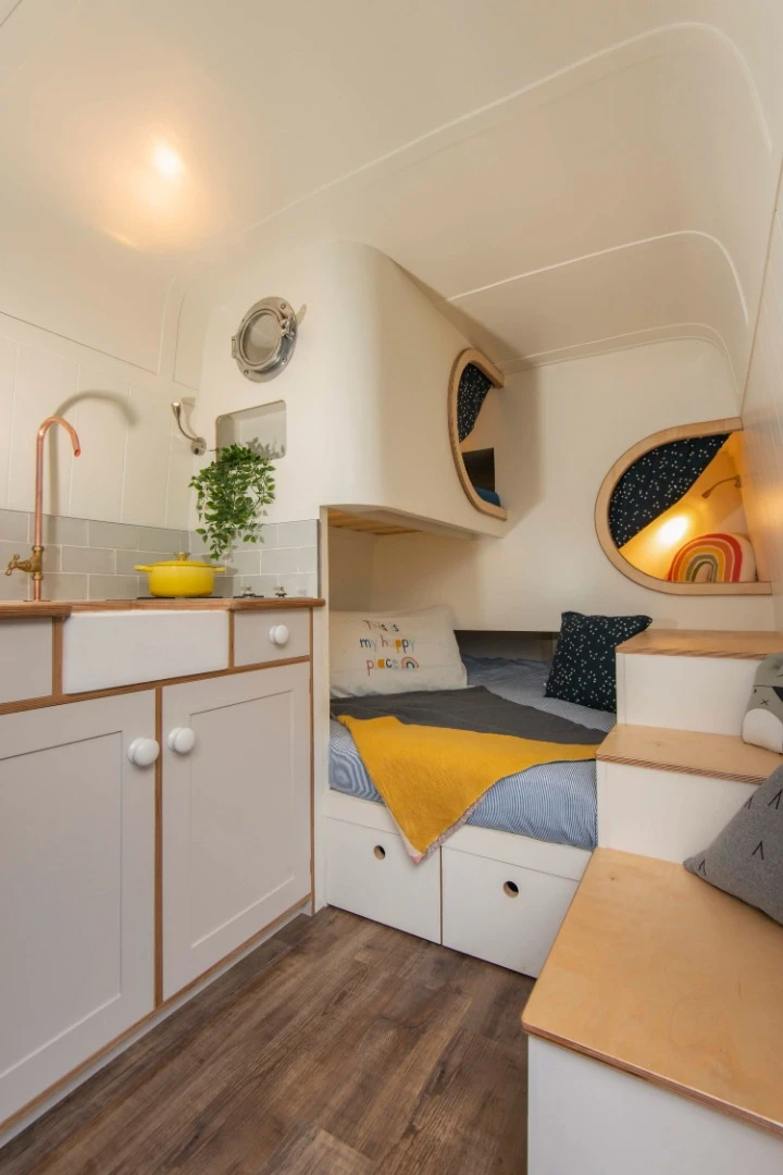 The stacked beds and open plan are both cosy and liveable at the same time