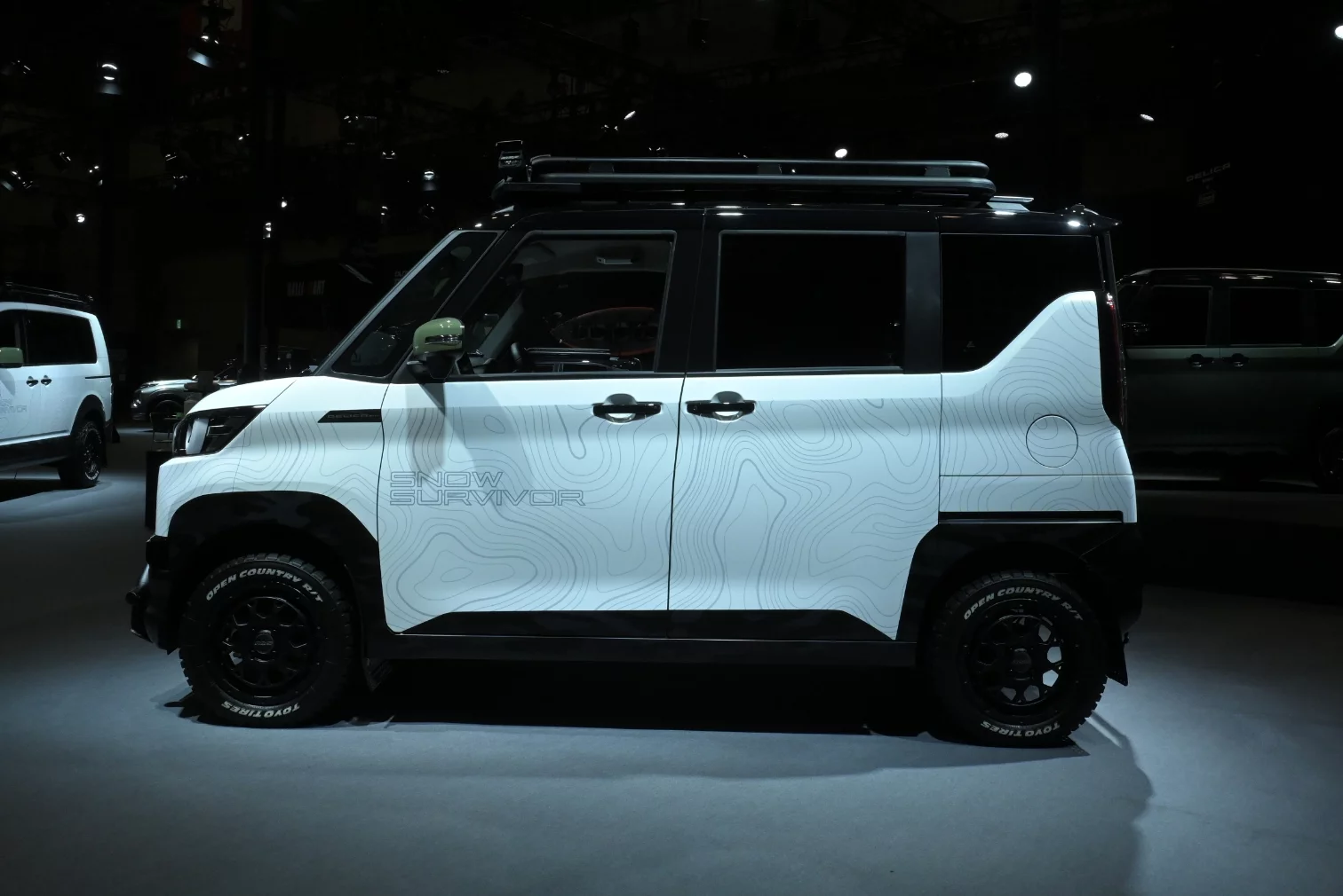The Delica Mini Snow Survivor doesn't look quite as camp-ready as the Coleman van but does include an in-vehicle bed, according to Mitsubishi's description