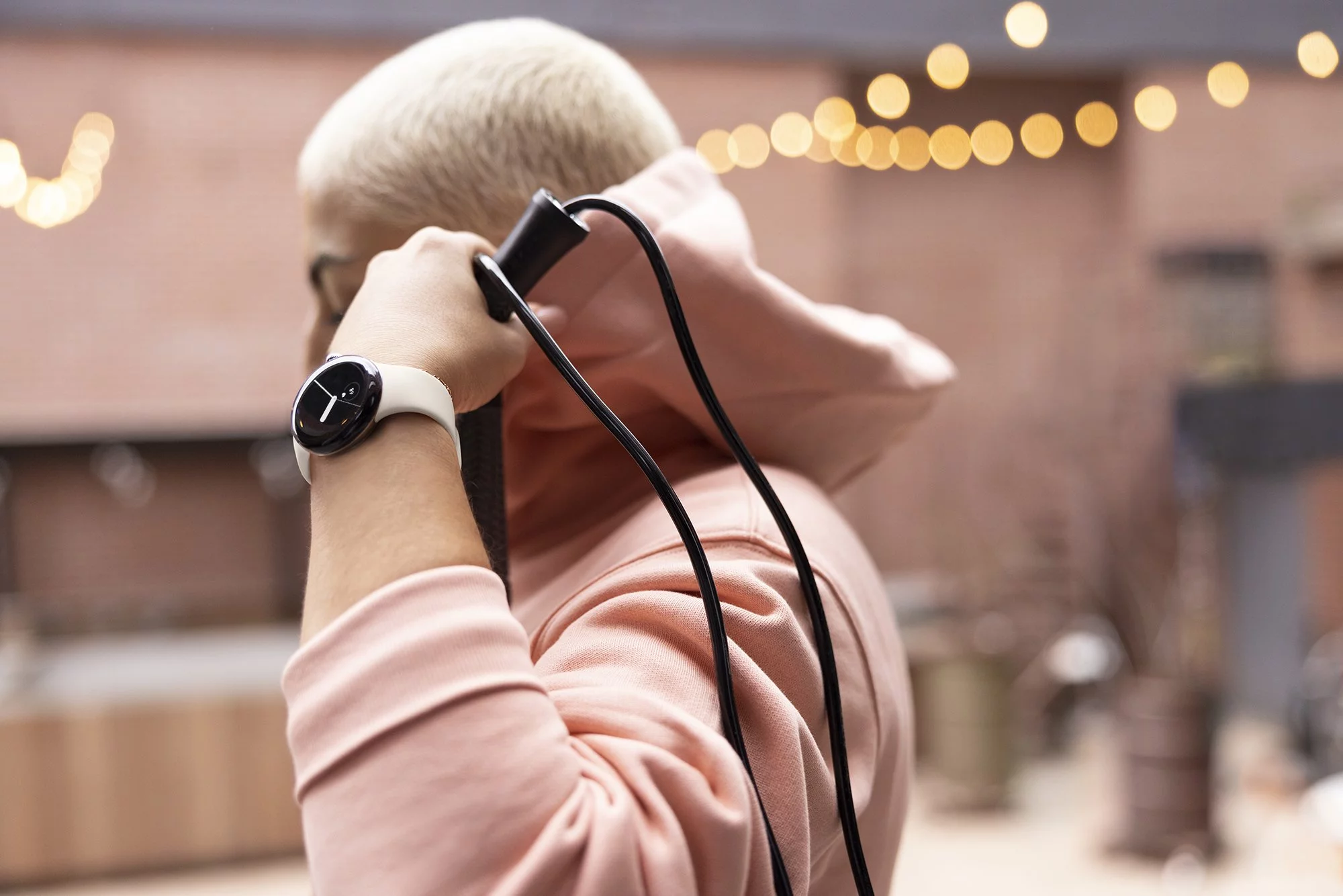 Fitbit integration puts exercise modes within reach, along with access to key workout and health metrics