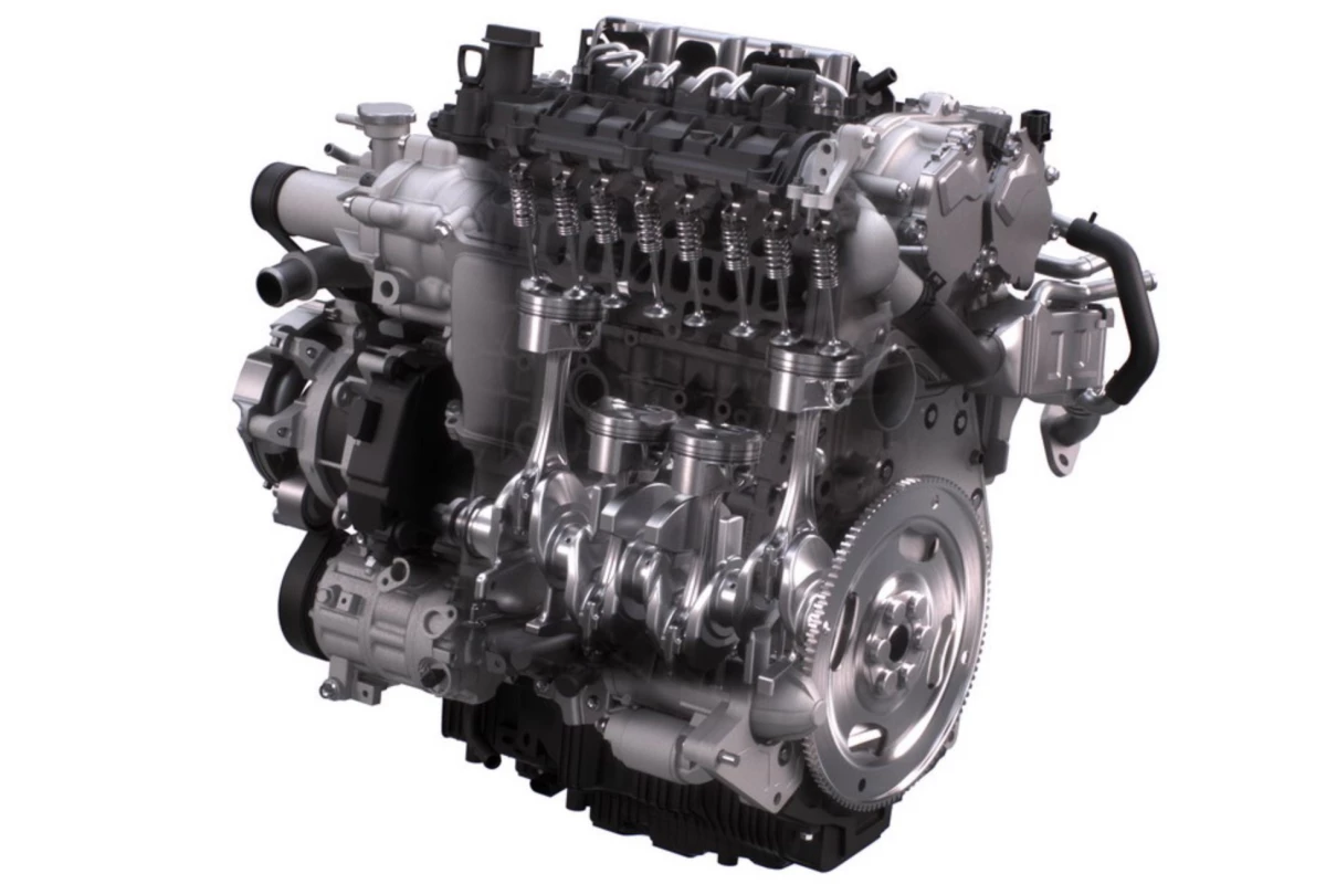 Cutaway of the Skyactiv-X engine showing the dual ports and valves in the inline-four design