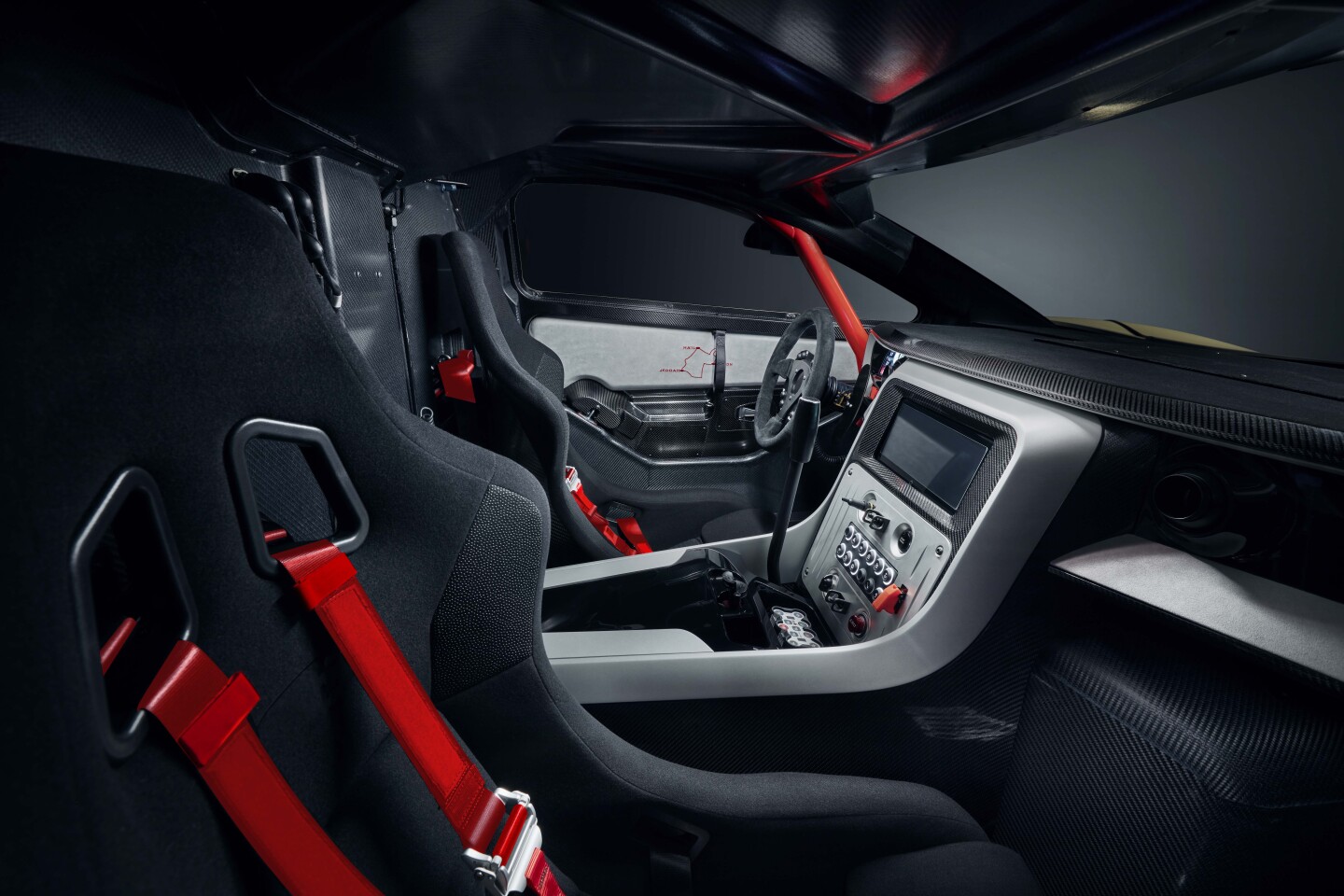 The interior is designed to deliver some comforts of a road car, but it's still pretty stripped back and race-inspired