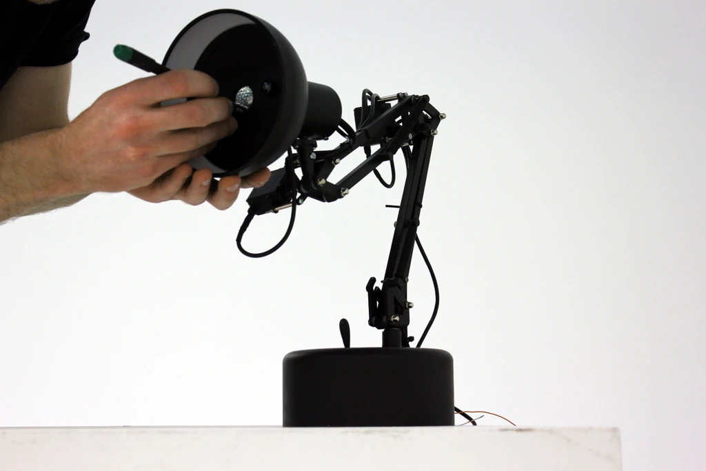 Although it looks like a standard desk lamp, many of Pinokio's components had to be redesigned to fit its electronics