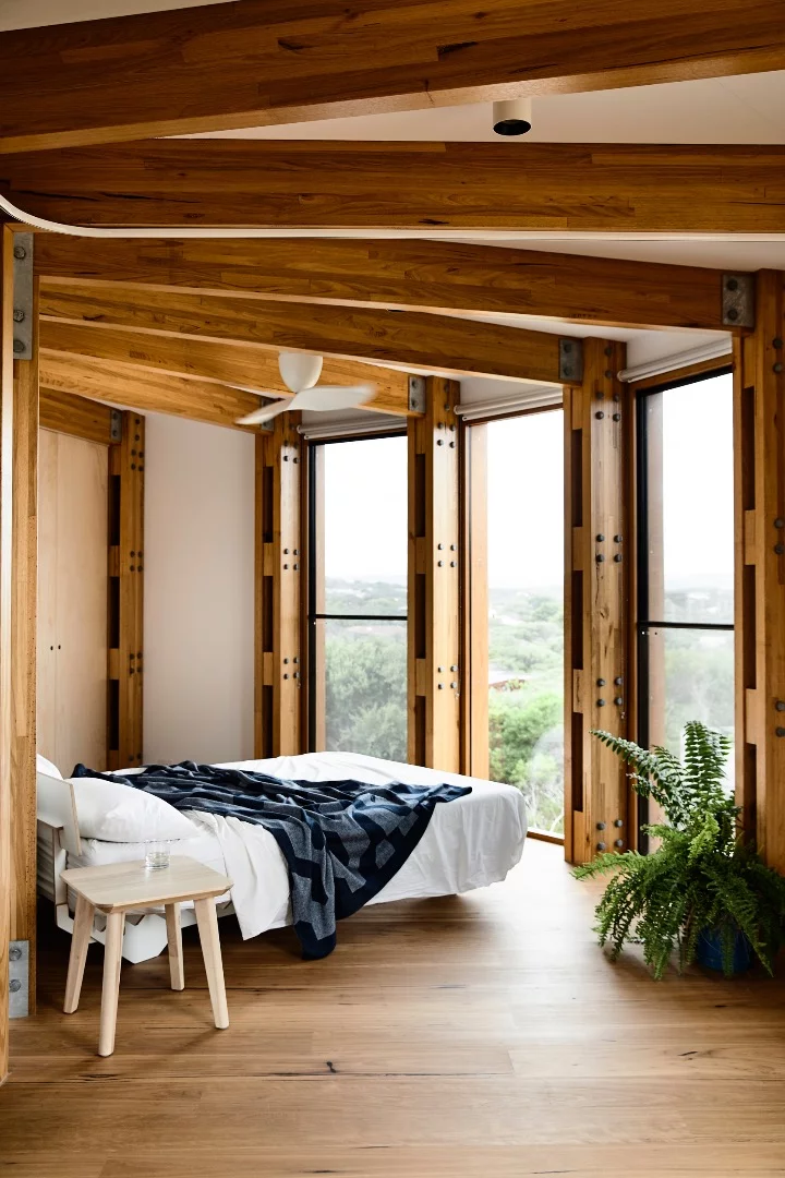 St Andrews Beach House's upstairs consists of bedrooms that are divided by curtains