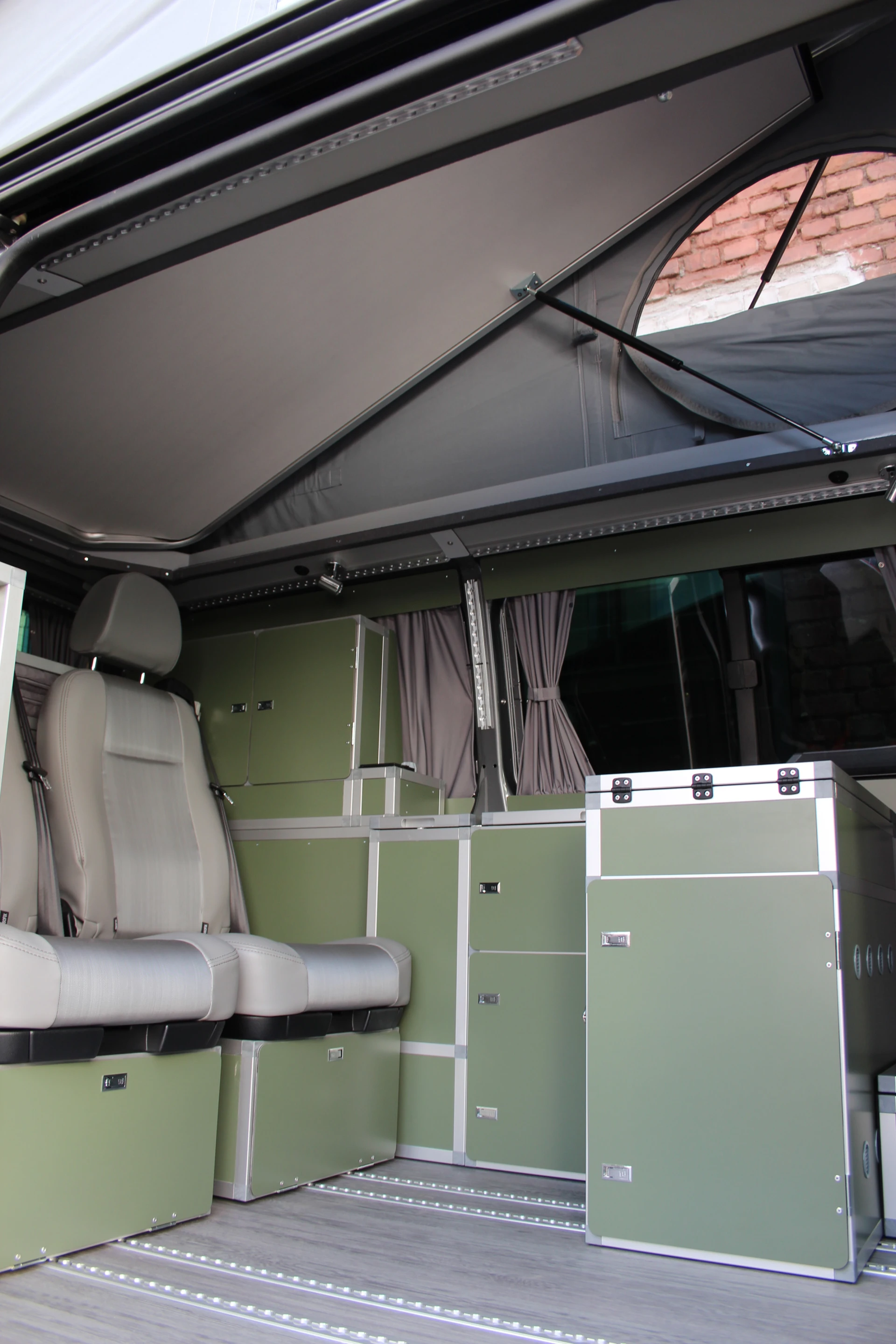 Terra Camper uses floor rail-mounted modules to create a versatile camper interior