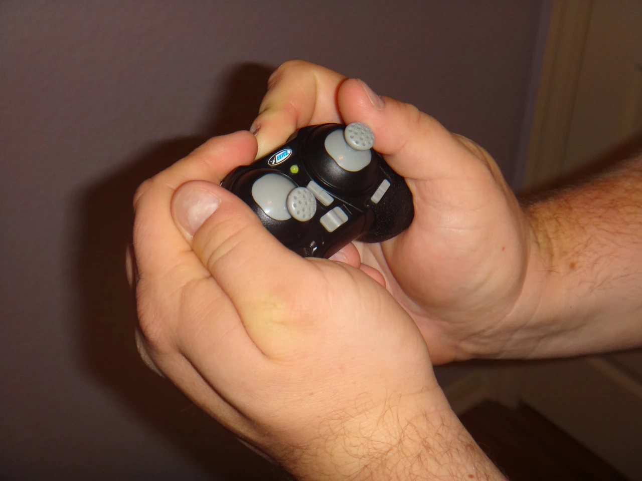 Holding the transmitter feels like holding a child's toy, especially if you have larger hands