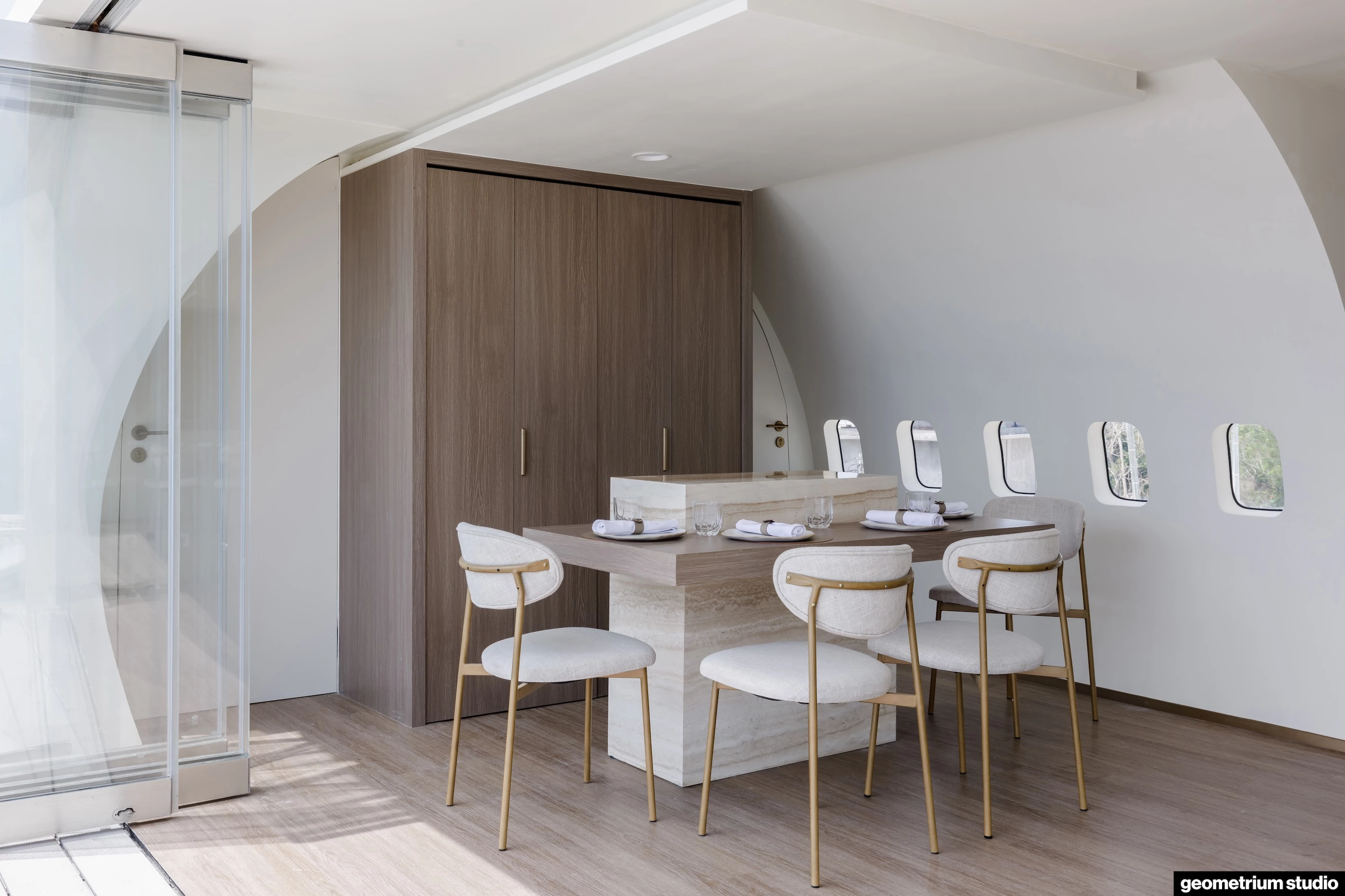 The Private Jet Villa's center is taken up by an open living, dining and kitchen area