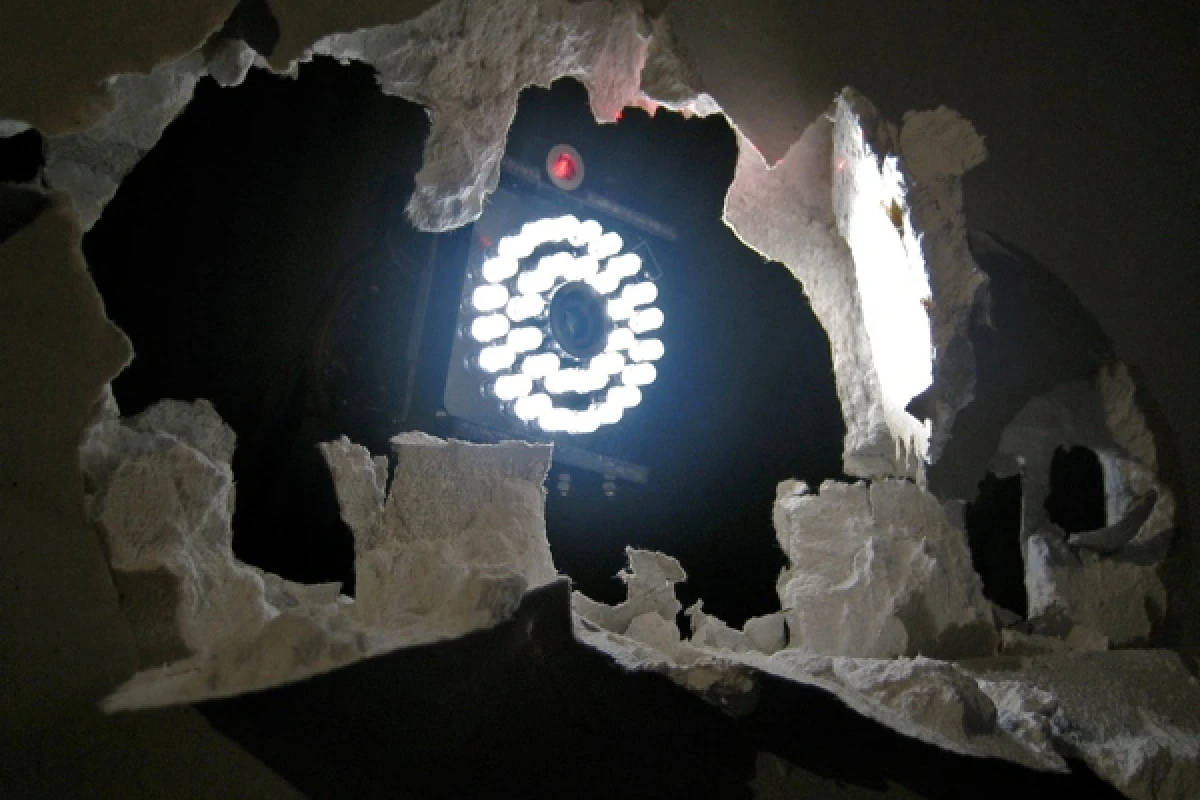 Accomplice is an artwork in which artificially intelligent robots gradually destroy a wall