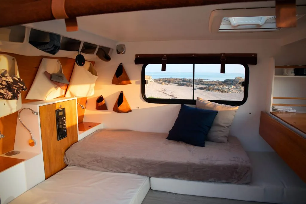 The three mattresses set up as an L-shaped sofa during the day