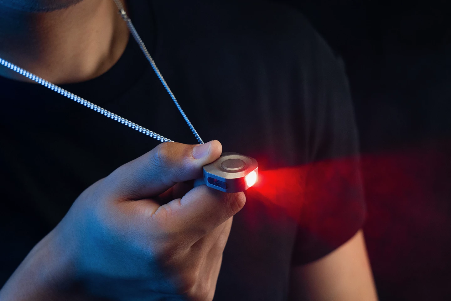 The flashlight can be attached to a chain or keyring via an integrated hole