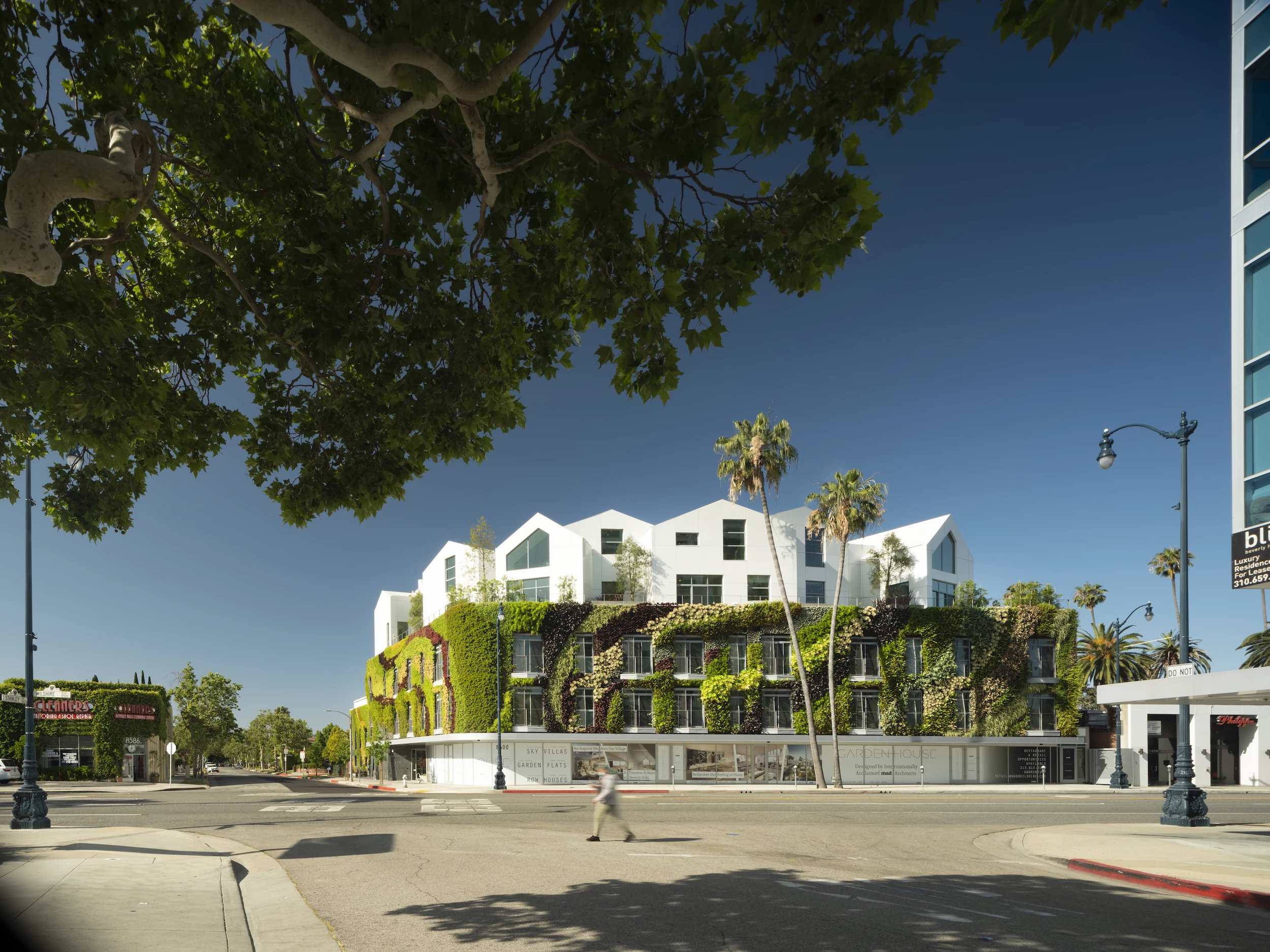 Gardenhouse consists of a large base hosting retail stores, a gym and homes, with a cluster of different homes on top of it