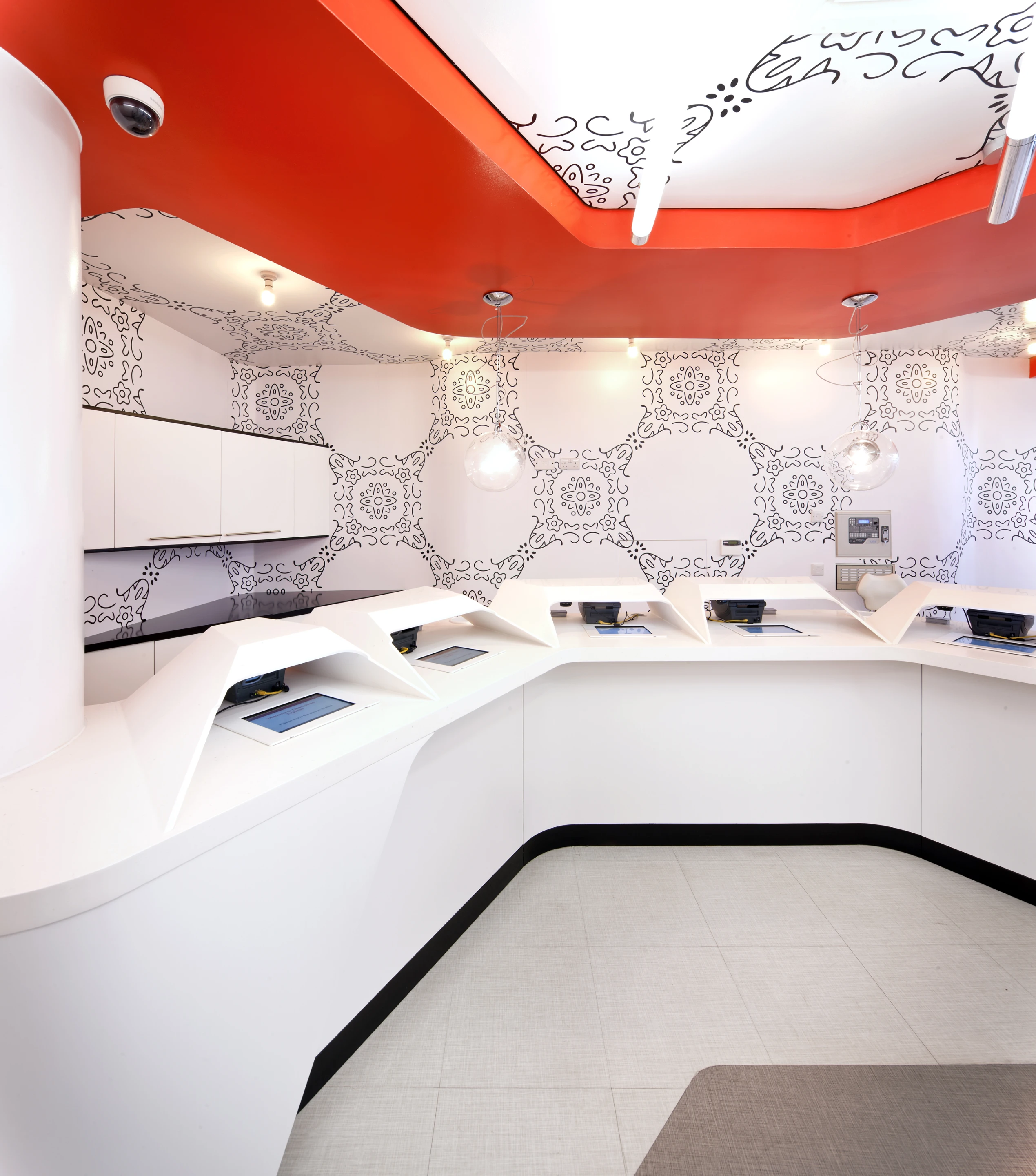 A series of iPads located in the reception area, allows patients to log themselves into the system